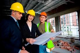 Three people discussing crucial details about the project and ensuring all construction insurance verification services are thoroughly handled.