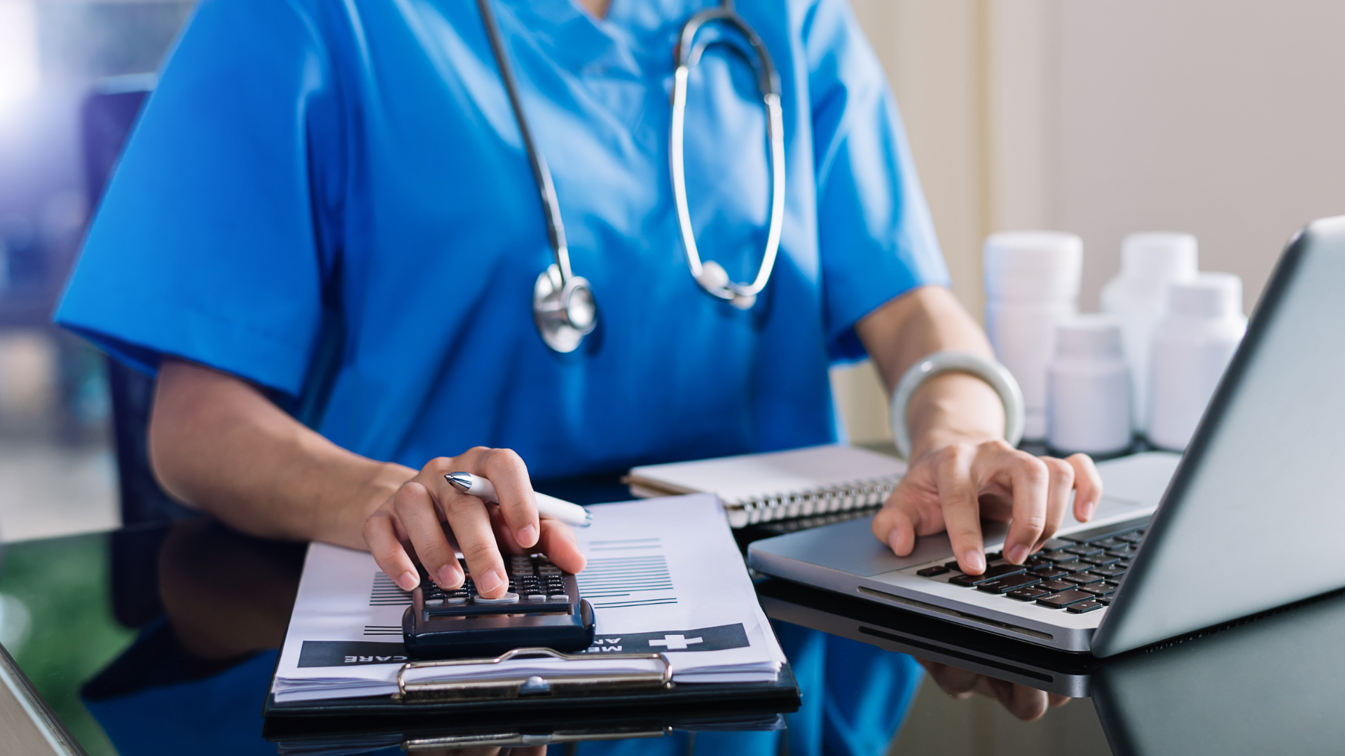 A healthcare professional in blue scrubs providing health insurance verification services.