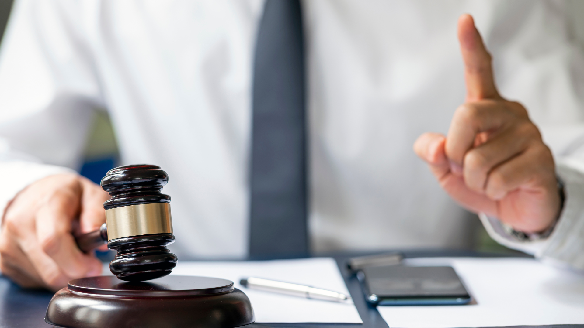 A person in a suit sits at a desk —a signal of important decisions to come in real estate development.