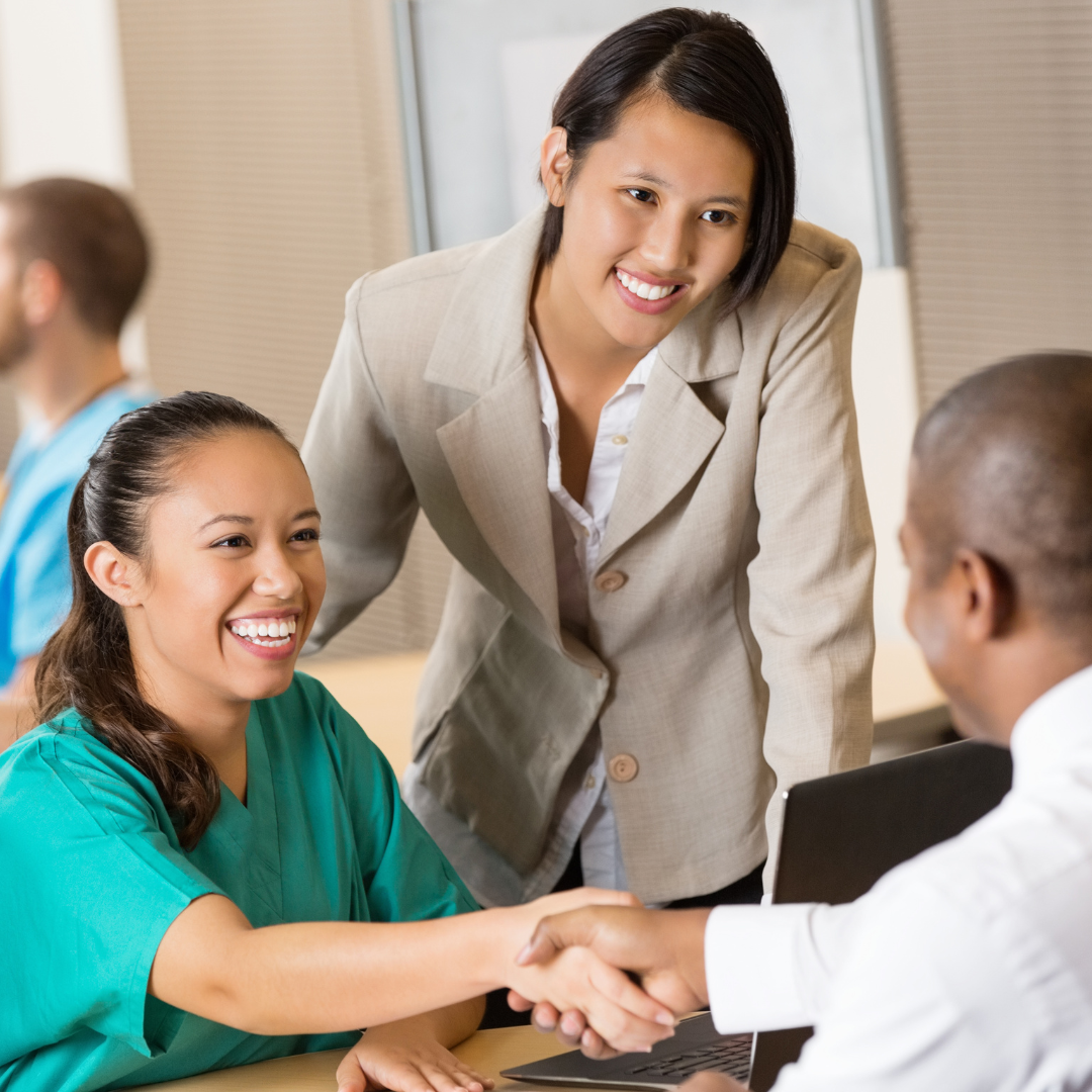 A woman shaking hands with an enterprise risk management consultant.