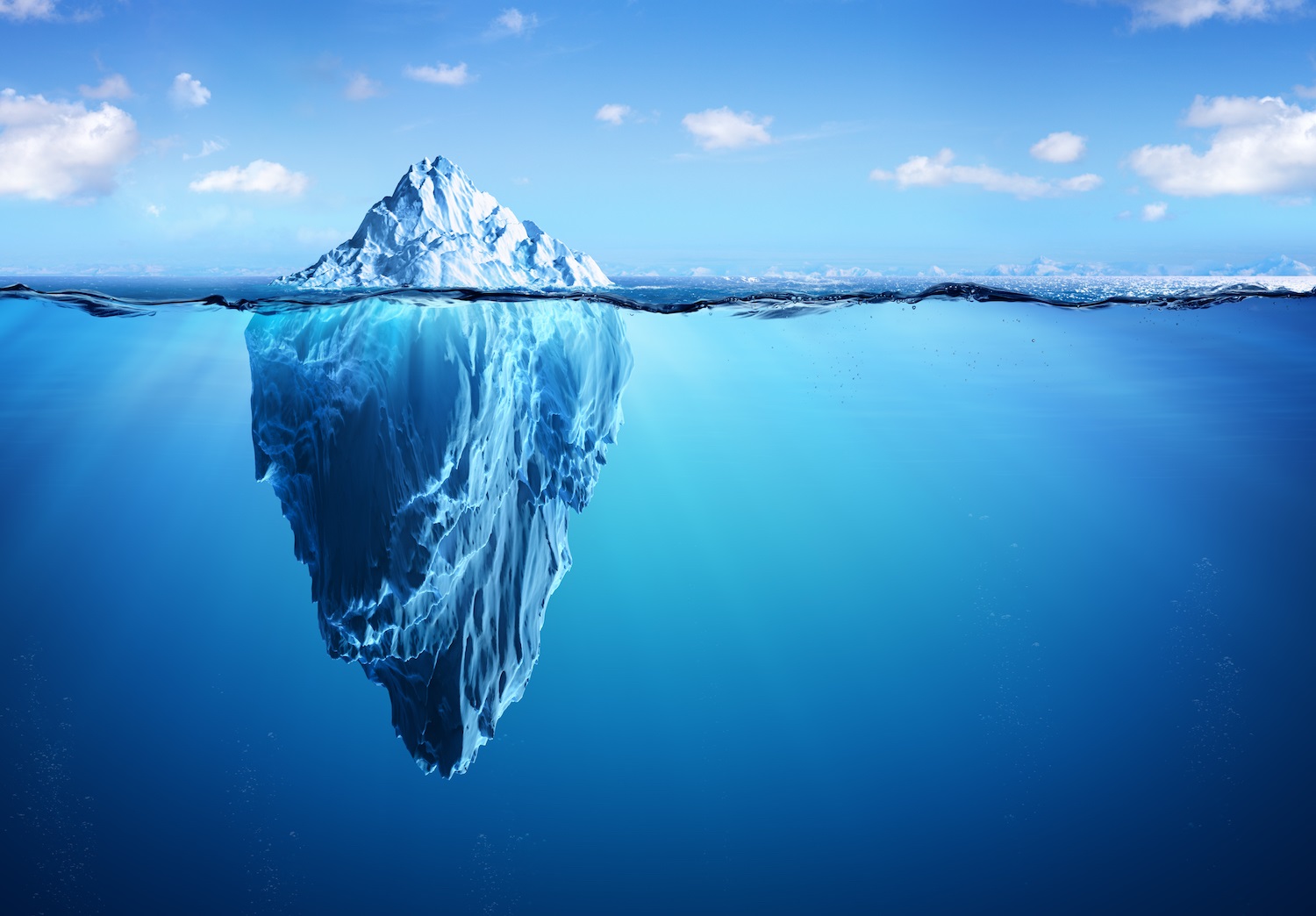 A large iceberg, with a small visible portion above the water