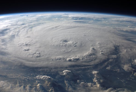 A view of a massive hurricane from space shows the swirling clouds and the eye of the storm