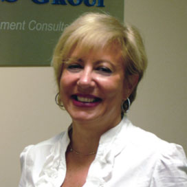 A woman with short blonde hair and a white blouse, identified as a renowned risk management consultant