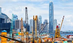 Construction site with city skyline backdrop