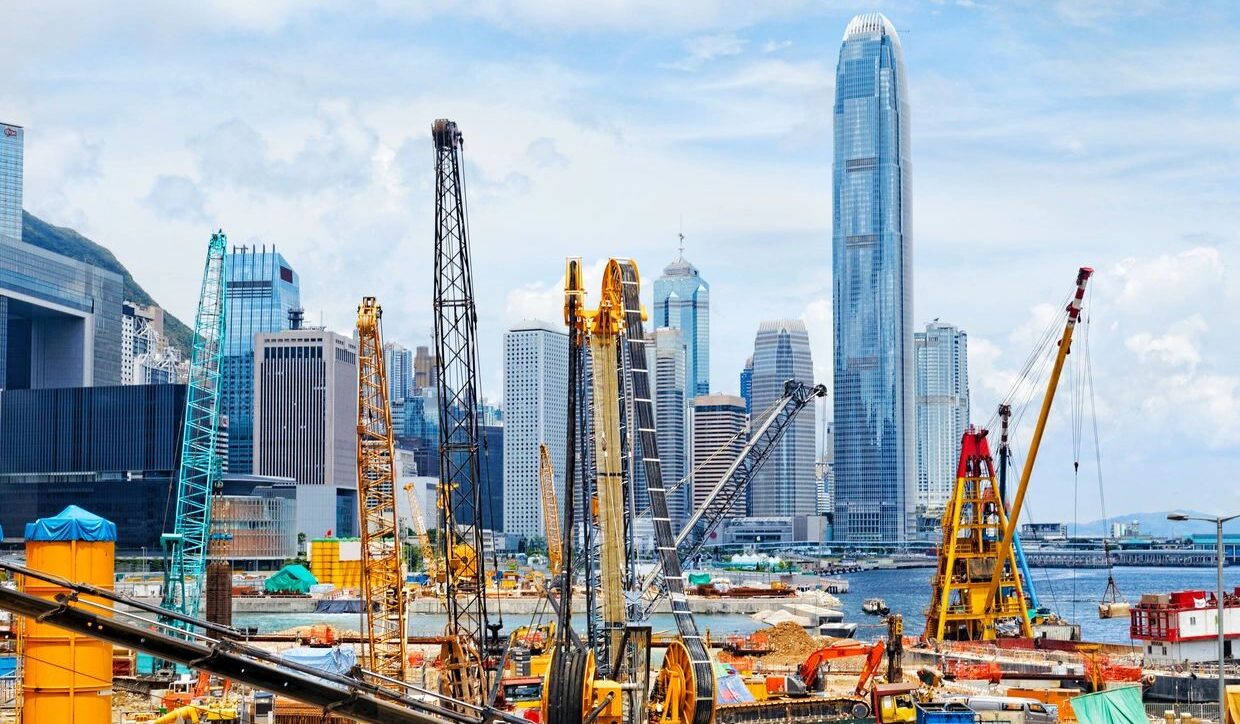 Construction site with city skyline backdrop
